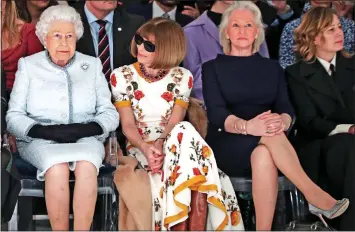  ?? ?? FASHION TIPS: Ms Kelly, third from left, joins the Queen and Anna Wintour at London Fashion Week