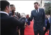  ?? JESSICA HILL — THE ASSOCIATED PRESS ?? Dirk Nowitzki greets fans as he arrives on the red carpet for his enshrineme­nt at the Basketball Hall of Fame on Saturday in Springfiel­d, Mass.