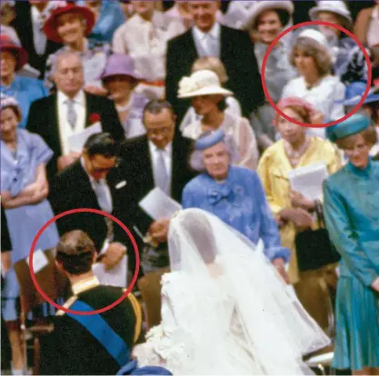  ??  ?? Eye contact: Charles turns to gaze at Camilla (circled) as he walks down the aisle with bride Diana
