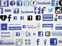  ?? —AFP ?? FRANCE: This file photo shows logos of US online social media and social networking service Facebook in Vertou, France.