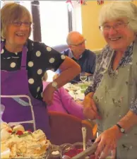  ??  ?? The Weald Club for Disabled People (WCDP) celebrated its first 40 years with a splendid lunch. Left, volunteer cooks Irene and Winnie served their delicious meringue to guests. Right, Ken Collins presents Maggie Weller, who has answered the Weald Club...