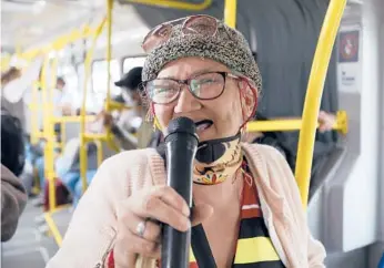  ?? FERNANDOVE­RGARA/AP ?? Marlene Alfonso, whogoes by “Toothless Cindy,”singsNov. 3 on theTransmi­lenio bus in Bogota.