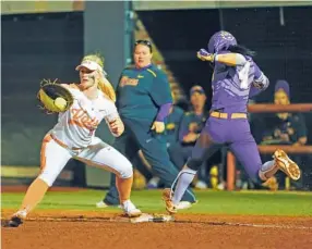  ?? PHOTO BY AUSTIN PERRYMAN/TENNESSEE ATHLETICS ?? Tennessee first baseman Haley Bearden awaits the throw as LSU’s Aliyah Andrews lunges toward the bag during their quarterfin­al matchup in the SEC tournament Thursday at Sherri Parker Lee Stadium in Knoxville. The Vols lost 6-2 in their only game at the...