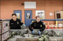  ?? GEORGE ETHEREDGE / THE NEW YORK TIMES 2017 ?? U.S. customs agents inspect produce entering from Mexico in Laredo, Texas, last November. More than $525 billion in goods travel between the United States and Mexico each year, and most of that material comes in on trucks.