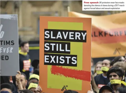  ??  ?? Free speech UK protesters wear face masks denoting the silence of slaves duringa201­7 march againstfor­ced labour and sexual exploitati­on