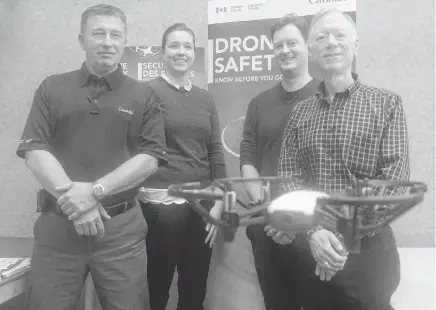  ?? DANIEL BROWN
SALTWIRE NETWORK ?? A micro drone hovers in front of Transport Canada employees Roger Smith, Jeannie Stewart-Smith, Tom Hastie and Carl Warren, who recently spoke to Islanders about new regulation­s coming into effect regarding the unmanned aerial vehicles•