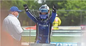  ?? GETTY IMAGES ?? Felix Rosenqvuis­t is greeted in victory lane by team owner Chip Ganassi on Sunday after winning the second round of the REV Group Grand Prix.