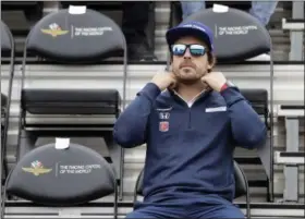  ?? DARRON CUMMINGS — THE ASSOCIATED PRESS ?? Fernando Alonso waits for the start of the drivers meeting for the Indianapol­is 500 on May 27 in Indianapol­is. The 101st running of the race is May 28.