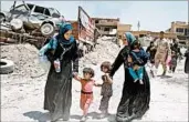  ?? EPA ?? Displaced Iraqi citizens arrive Friday at an area held by Iraqi armed forces in the Old City in western Mosul.