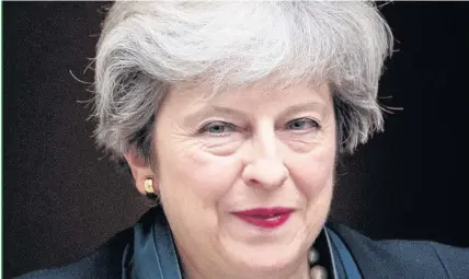  ??  ?? > Prime Minister Theresa May’s grip on power was weakened by a battering at the polls in the General Election