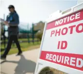  ?? CHRIS CARLSON/AP ?? Under the state’s new voter ID law, someone who can’t show a qualifying ID casts a provisiona­l ballot. They must either then fill out an ID exception form or return to their county board office with their ID before the county canvass for their ballot to count.