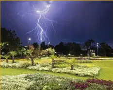  ?? Photo: Kevin Farmer ?? DIRECT STRIKE: Lightning is seen over Laurel Bank Park as Toowoomba prepares for the Carnival of Flowers.