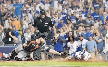  ?? Robert Gauthier Los Angeles Times ?? LOGAN FORSYTHE of the Dodgers eludes the tag of Astros catcher Brian McCann to score the tying run in the bottom of the 10th inning. Forsythe scored from second on a two-out single by Enrique Hernandez.