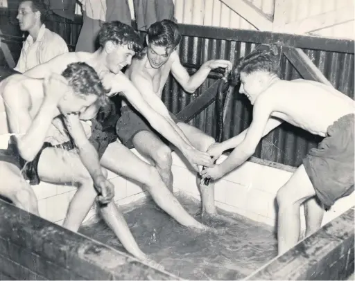  ??  ?? Above: Members of the RTB Youth XI in the corrugated iron changing room at Wordsley Park