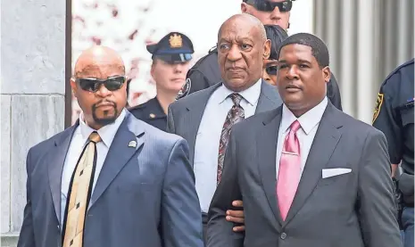  ?? GILBERT CARRASQUIL­LO, WIREIMAGE ?? Bill Cosby leaves the Montgomery County Courthouse on Tuesday after a judge ordered him to stand trial on sex assault charges.