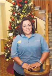  ?? JIM THOMPSON/JOURNAL ?? Medication assistant Prisilla Molinar will be working at Brookdale Tramway Ridge senior care home, where, she says, “It’ll be like a regular Christmas.” She’ll celebrate after work.