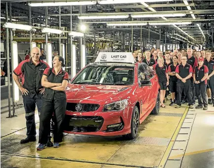  ?? PHOTOS: SUPPLIED ?? Holden employees pose with the last Commodore.