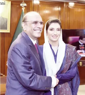  ?? ?? Islamabad: President Asif Ali Zardari congratula­ting Aseefa Bhutto Zardari on taking oath as member of the National Assembly. — NNI