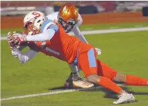  ??  ?? Sandia’s Kevin Jackson (1) make a reception for a touchdown in front of Eldorado’s Elijah Smith.