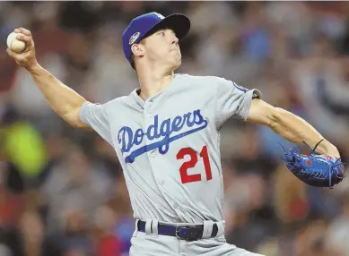  ?? AP FILE PHOTO ?? BIG SPOT FOR YOUNG ARM: Rookie starter Walker Buehler gets the ball tonight for the Dodgers as they host the Brewers in Game 3 of the NLCS, with the series tied at one apiece.