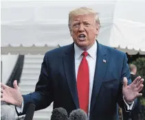  ?? SUSAN WALSH THE ASSOCIATED PRESS ?? U.S. President Donald Trump’s approval rating is holding steady as the House of Representa­tives presses forward with an impeachmen­t probe, according to a new poll.