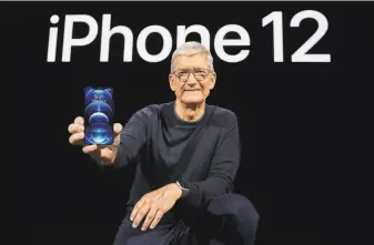  ?? Brooks Kraft / Apple Inc. / AFP ?? Tim Cook, CEO of Apple, unveiled the new iPhone 12 Pro this month. Google’s search engine is the default choice on Apple’s phones and other devices in a deal between the two companies.