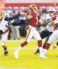  ?? CAROLYN KASTER/ASSOCIATED PRESS ?? Carolina defensive end Marquis Haynes disrupts a pass by Washington quarterbac­k Dwayne Haskins on Sunday. The play was ruled a fumble, and the Panthers recovered. Haskins was replaced by Taylor Heinicke early in the fourth quarter.