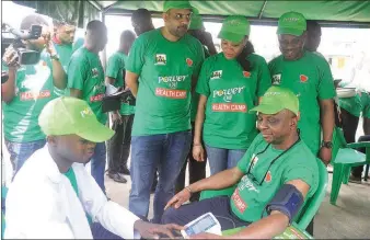  ??  ?? The Permanent Secretary, Ministry of Health, Ogun State,Dr Nafiu Babatunde being examined by Power Oil Medical Consultant,Dr Usman Kabir with the Area Sales Manager, Power Oil,Vikash Lalwani,Public Relations Manager, Omotayo Azeez and Director, Public...