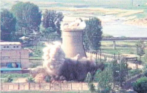  ?? AP ?? The demolition of a 20-metre-tall cooling tower in Yongbyon in 2008. Foreign journalist­s are pouring into Wongsan to observe the dismantlin­g of the Punggye-ri site later this week.