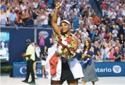  ?? VAUGHN RIDLEY/GETTY ?? Serena Williams waves to the crowd as she leaves the court after losing on Wednesday during
the National Bank Open at Sobeys Stadium in Toronto.