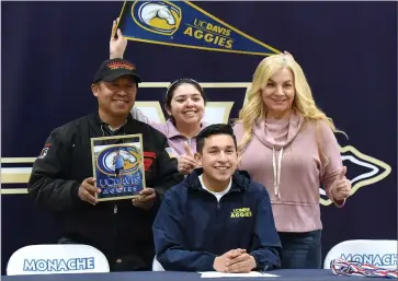  ?? RECORDER PHOTO BY CHIEKO HARA ?? Monache High School standout distant runner, Ivan Mendez, signed a National Letter of Intent to University of California, Davis with his family and friends attending Friday, Feb. 8.