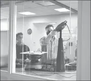  ?? Photo submitted ?? Instructor for the Rapid Prototypin­g course at Penn State DuBois, Johnny Williams, becomes familiar with the new turntable 3-D printer in the on-campus Idea Lab, while Damon Johnson of Cimquest Inc. guides the training process.