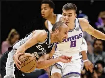  ?? RICH PEDRONCELL­I / AP ?? Guard Manu Ginobili, 40, considered retiring after the Warriors swept the Spurs in the playoffs. After a conversati­on in August with coach Gregg Popovich, he decided to return.