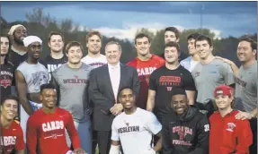  ?? Olivia Drake/Wesleyan University ?? Bill Belichick with Head Coach Dan DiCenzo and the Wesleyan football team.