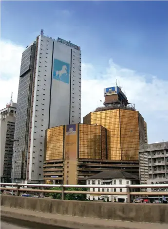  ??  ?? A view of Marina, Lagos showing the headquarte­rs of First Bank of Nigeria Plc and Union Bank of Nigeria Plc