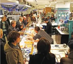  ??  ?? PARIS: Members of the public shop throughout the Galeries Lafayette department store yesterday in Paris. — AFP