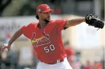  ?? JOHN BAZEMORE/THE ASSOCIATED PRESS ?? Cardinals pitcher Adam Wainwright throws Thursday during a game in Jupiter, Fla. Wainwright offered teammate Ryan Sherriff a bicycle but he declined, prompting the veteran to rent a car for the minor leaguer.