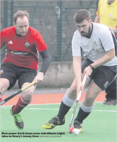  ?? AIDEN O’REILLY/PACEMAKER ?? More power: North Down scorer Josh Gilmore (right) takes on Newry’s Jeremy Greer