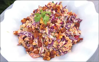  ??  ?? Press photo This photo shows Confetti Coleslaw from a recipe by Elizabeth Karmel in Amagansett, N.Y.Associated