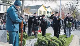  ?? MELINDA CHEEVERS NIAGARA THIS WEEK ?? During the laying of wreaths at a Sunday Remembranc­e Day ceremony in Niagara-onthe-Lake, representa­tives from Niagara Emergency Medical Services pay respects.