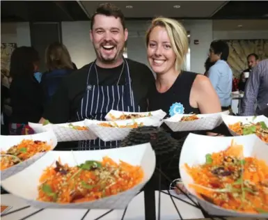  ?? VINCE TALOTTA/TORONTO STAR ?? El Gastronomo Vagabundo food truck chef Adam Hynam-Smith and his co-owner/operations manager Tamara Jensen made Tunisian carrot salad for the Terroir Hospitalit­y Industry Symposium.