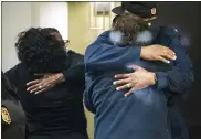  ?? THE INDIANAPOL­IS STAR VIA AP ?? People hug after learning that their loved one is safe after a shooting inside a FedEx building. Multiple people were shot and killed in a late-night shooting at a FedEx facility in Indianapol­is, and the shooter killed himself, police said.