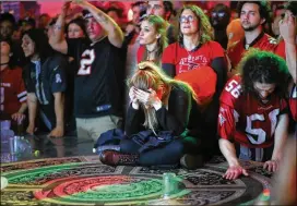  ?? MIGUEL MARTINEZ / AJC 2017 ?? Falcons fans at Park Tavern in Atlanta look on in disbelief as the Falcons lose the Super Bowl in overtime, via an astonishin­g comeback by the Patriots after being down 25 points Feb. 5, 2017, in Houston.