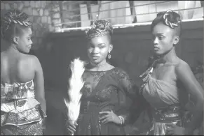  ?? Al-Hadji Kudra Maliro/AP ?? Models: Models Poses back stage for a photograph before a fashion show in Beni Eastern Congo . Young Congolese designer Miki Sikabwe has trained in Rwanda, Burundi and Kenya, but hasn't gotten the chance to show her work locally in eastern Congo for...