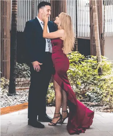  ?? Picture: SUPPLIED ?? BIG MOMENT: Cairns couple Sam Coelli and Emily Bradley were engaged on the Cairns Esplanade as the clock struck midnight on New Year's Eve.