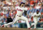  ?? MATT SLOCUM — THE ASSOCIATED PRESS ?? Philadelph­ia Phillies’ Aaron Nola pitches during the third inning of a baseball game against the Colorado Rockies, Tuesday in Philadelph­ia.