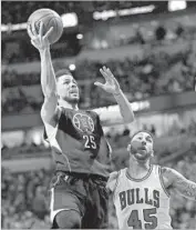  ?? Jonathan Daniel Getty Images ?? AUSTIN RIVERS, who scored only four points against the Bulls, drives past Denzel Valentine.