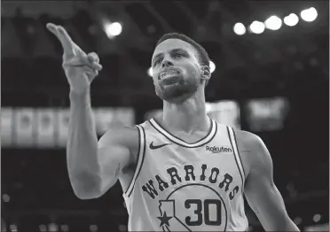  ?? BEN MARGOT/AP PHOTO ?? Golden State’s Stephen Curry made 11 3-pointers and scored 51 points — all in just three quarters — during the Warriors’ 144-122 win over the Wizards on Wednesday night in Oakland, Calif.