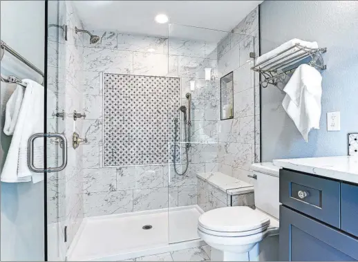  ?? Getty Images ?? One of the biggest trends in master bathroom remodels is to eliminate the tub and then turn the space into a large shower.