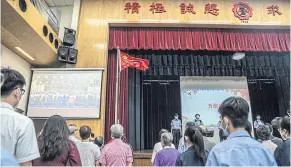  ?? BLOOMBERG ?? Students at Scientia Secondary School in Hong Kong attend a flag-raising ceremony to mark the 25th anniversar­y of the city’s handover to China yesterday.